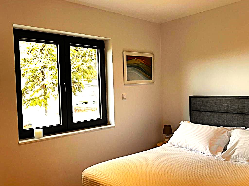 Bedroom 1 natural light and garden view, Eutopia Villa